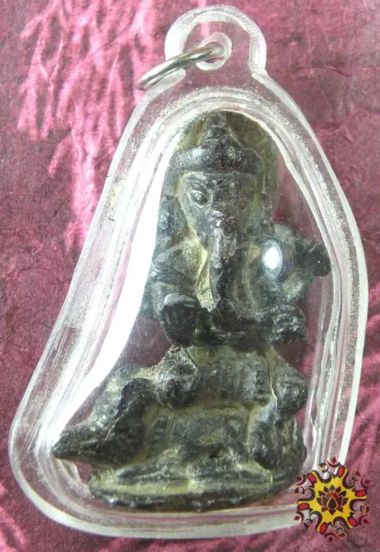 Antique statuette of the elephant god Ganesh riding the rat Mooshika.