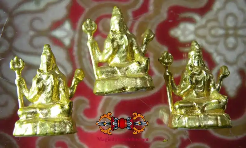 Small golden statuettes/amulets of Shiva.