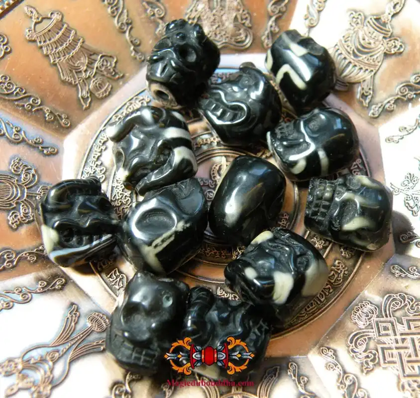 Tibetan Dzi agate beads in the shape of human skulls.