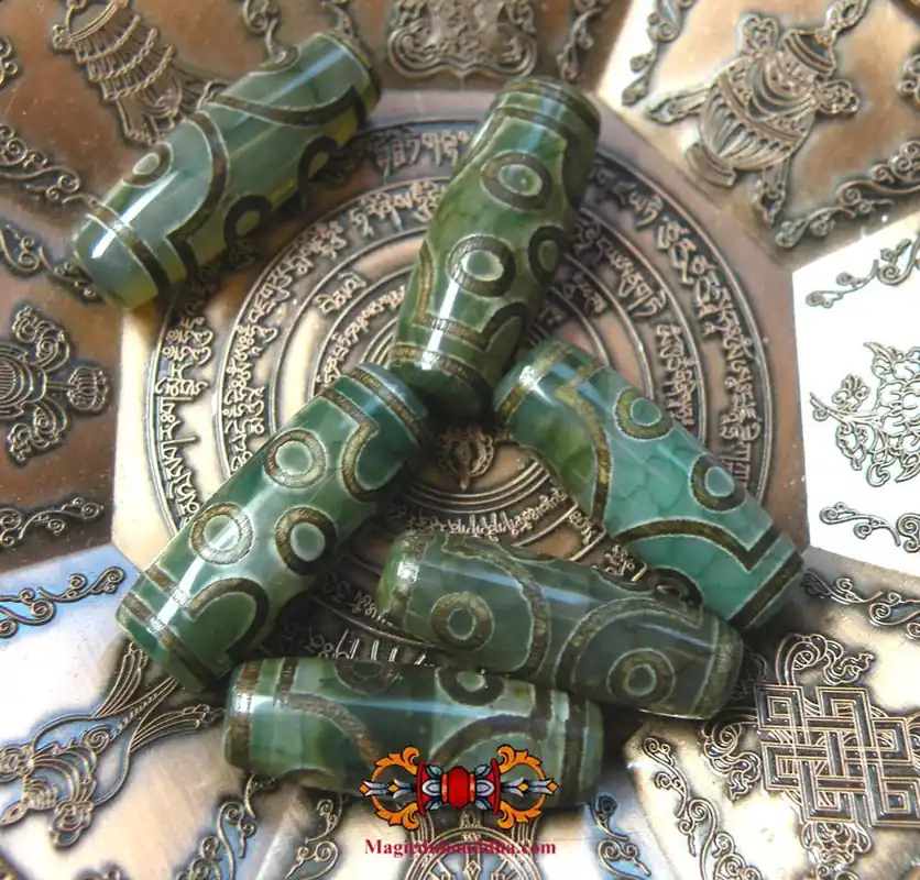 Tibetan Dzi beads with seven green eyes.