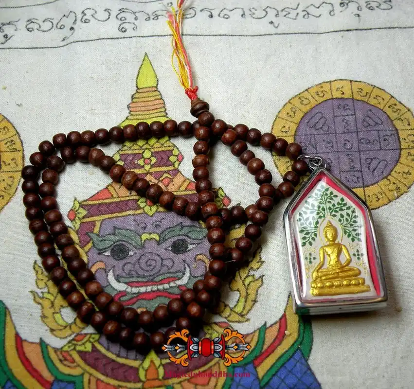 Sacred Buddhist prayer beads with amulet of Buddha Phra Budhajao.