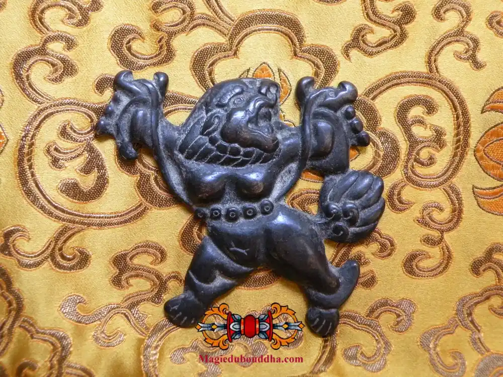 Large ancient Tibetan thogchag snow lion amulet.