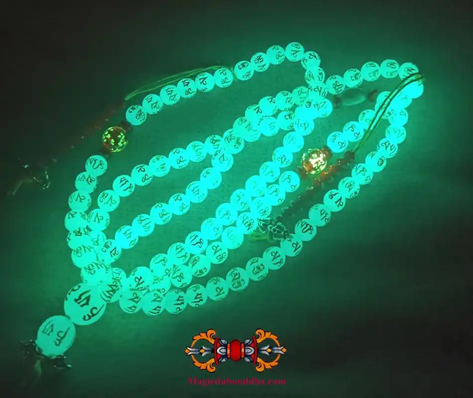 Buddhist rosary made of fluorescent Chinese sacred stone beads Ye Ming Zhu engraved with mantra.