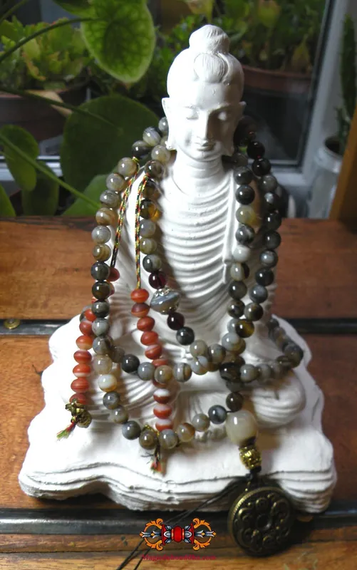 Tibetan mala rosary made of dzi agate.