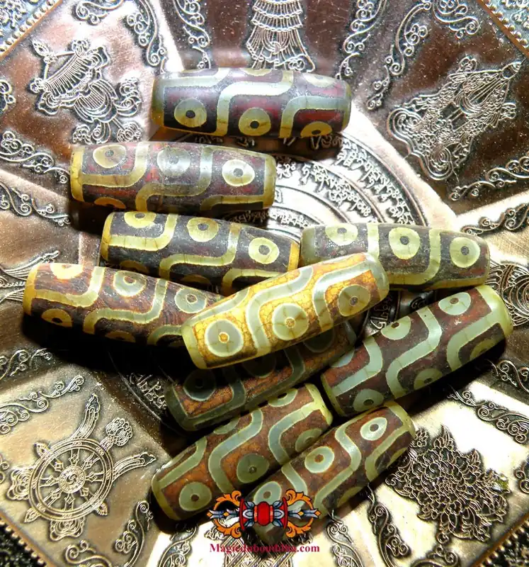 Small sacred Tibetan Dzi beads with nine eyes.
