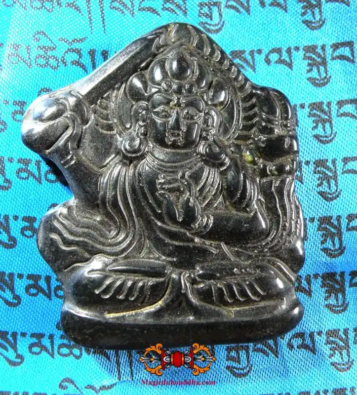 Large Tibetan Thogchag amulet of Manjushri in magnetic black stone.