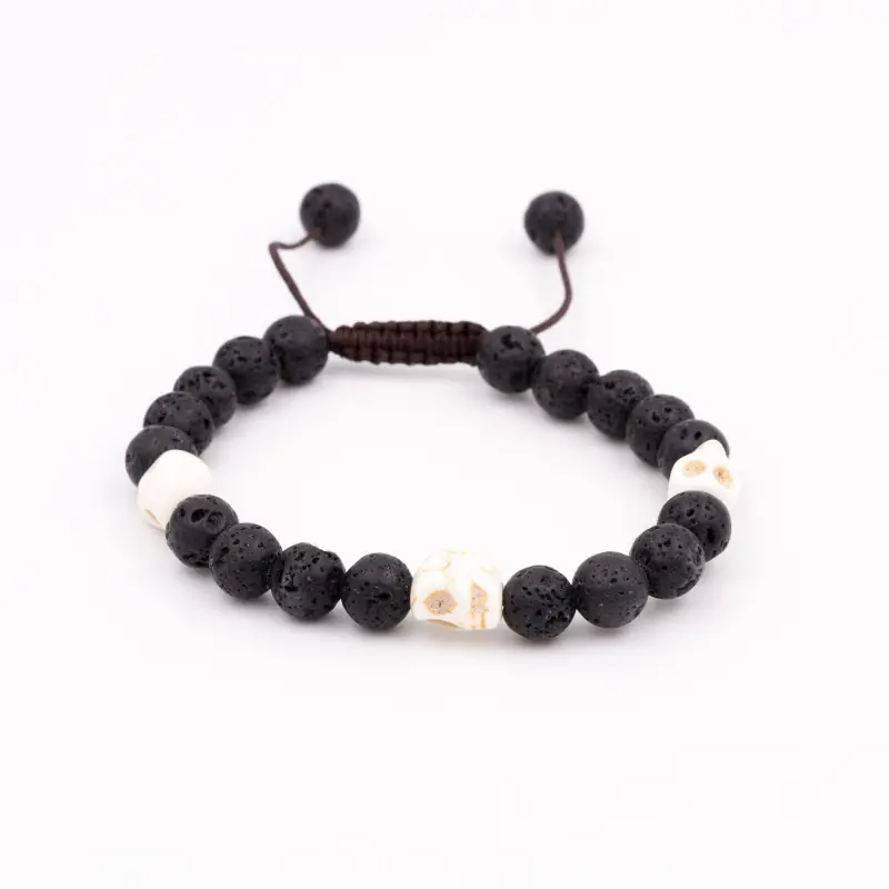 Bracelet mâlâ en pierre de lave avec crânes en os