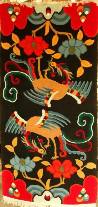 Le tapis tibétain avec une paire de phénix