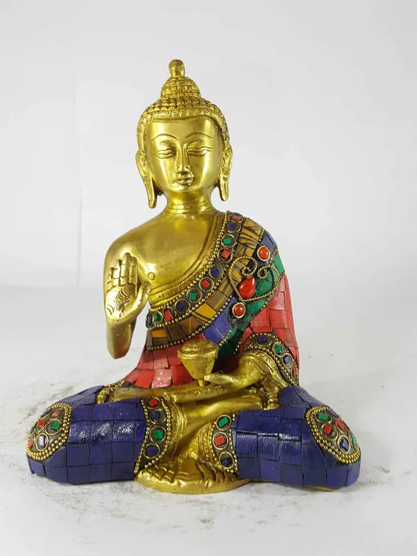 Statue du Bouddha Amoghasiddhi : Coulée de sable et mise en place des pierres.