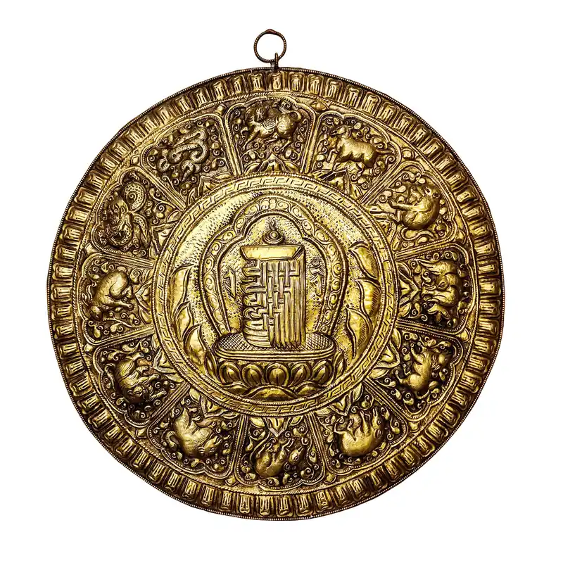 Calendrier tibétain en laiton avec le Kalachakra sacré