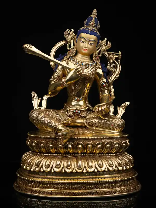 Statue en cuivre de Manjushri avec un visage doré