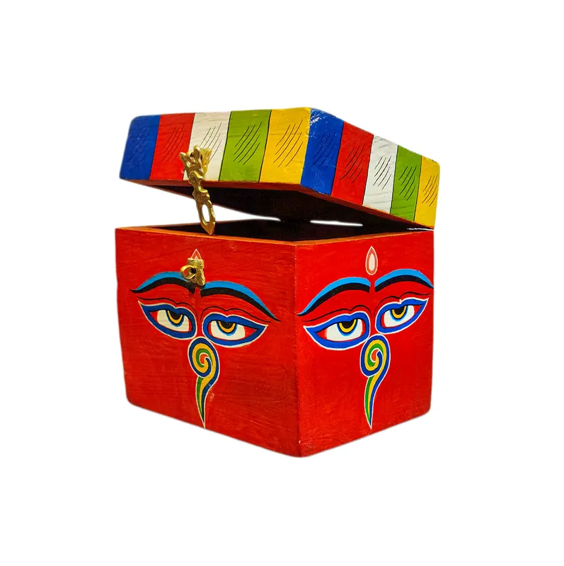 Boîte au trésor tibétaine ornée des yeux de Bouddha dans des couleurs traditionnelles