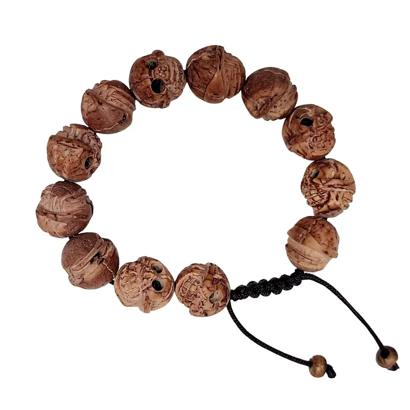 Bracelet en graine de Bodhi sculptée en forme de crâne Budi Chitta