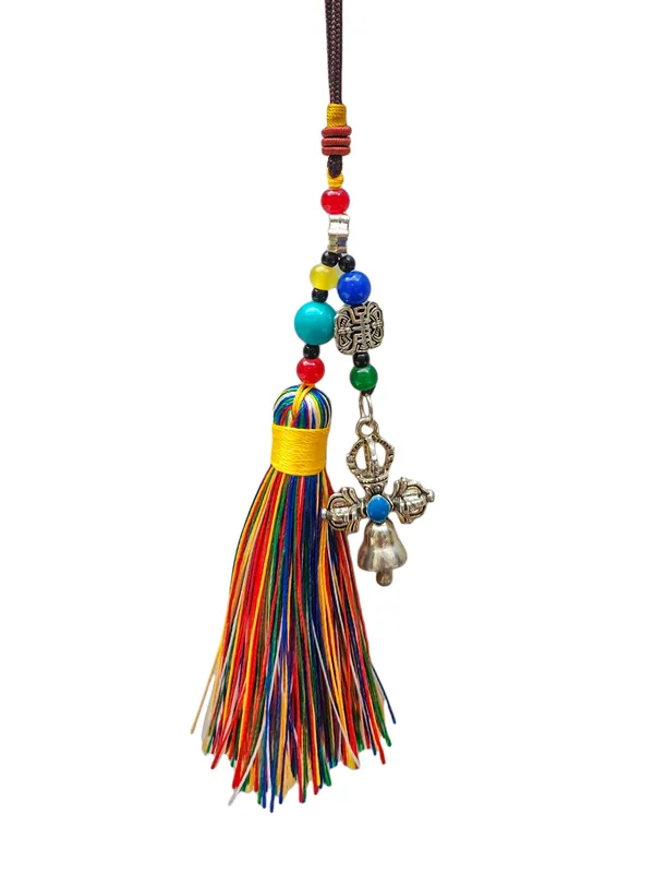 Cloche en métal et amulette bouddhiste dorje