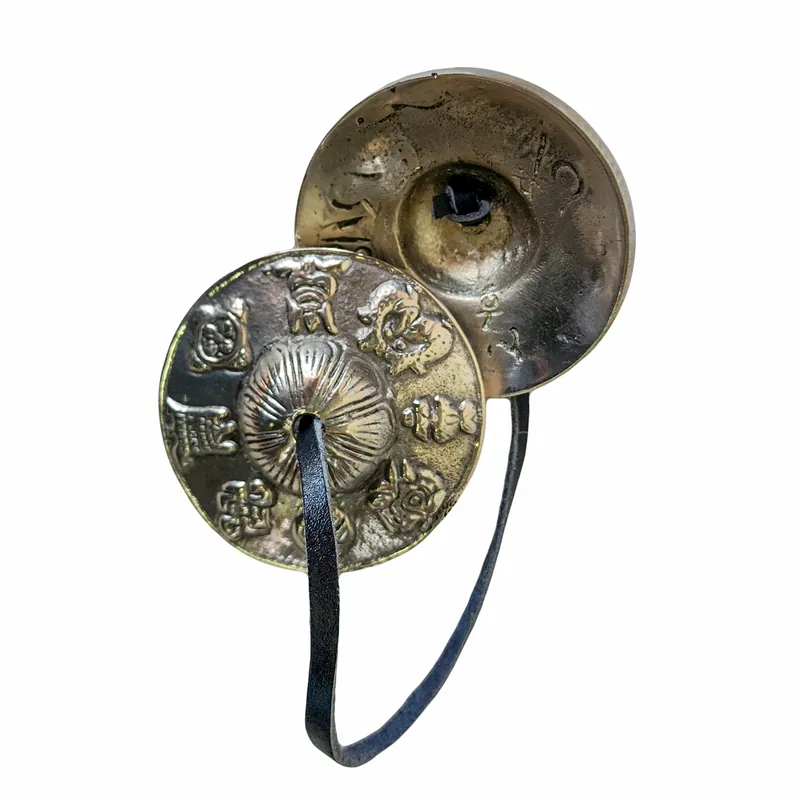 Tingsha en bronze avec un design d’Ashtamangala