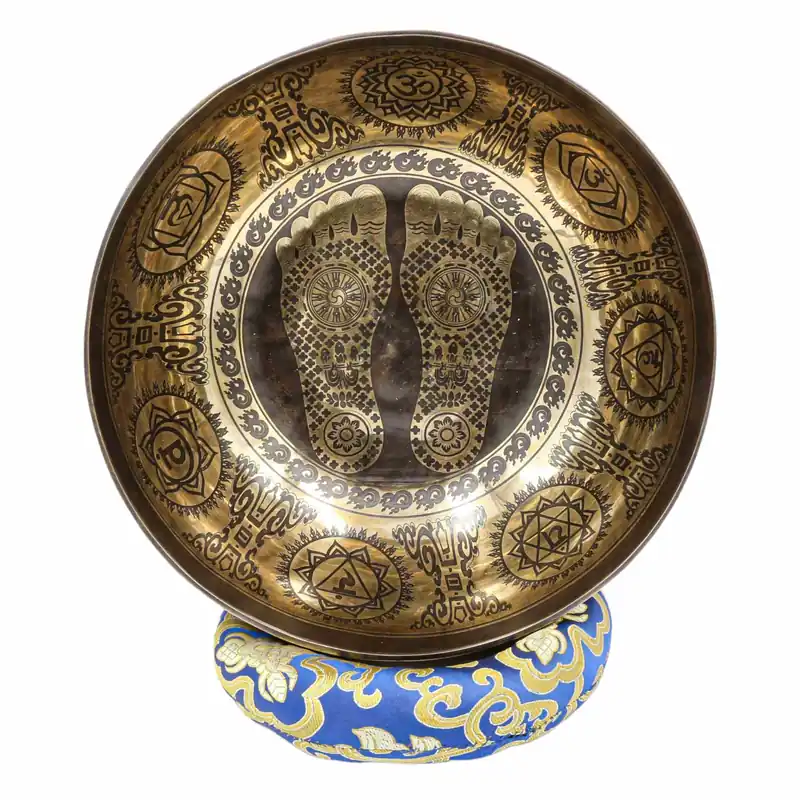 Bol chantant bouddhiste Jambati avec des pieds de Bouddha sculptés