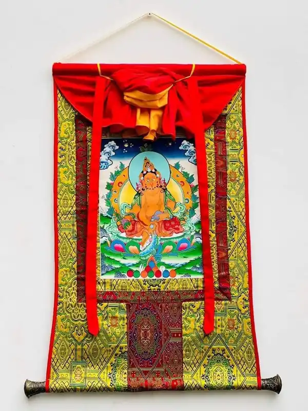 Art thangka encadré en soie jaune de Jambhala